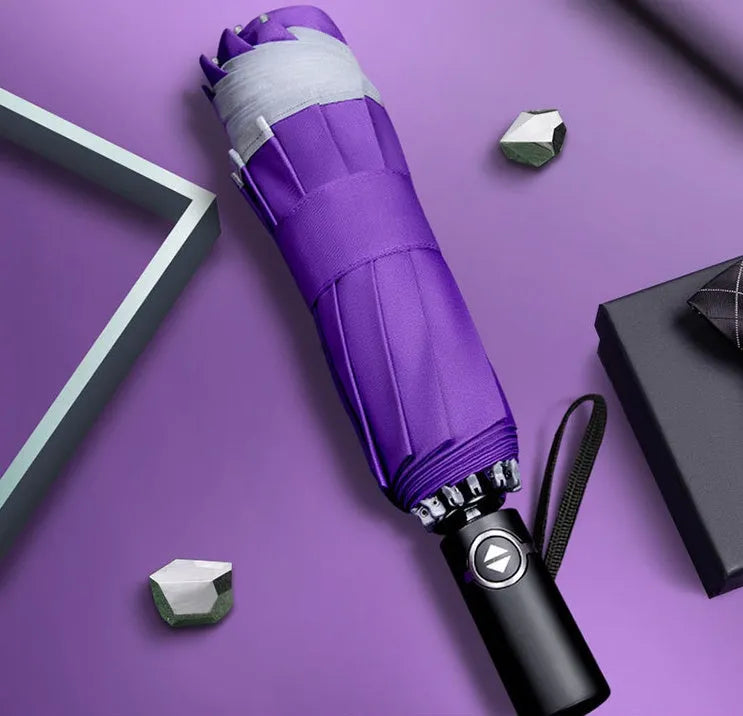 Inverted umbrella with auto close button and reflective stripes on black canopy