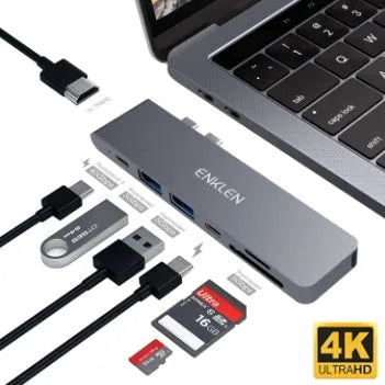Silver aluminium alloy USB-C multi-port hub with SD card slot, HDMI, and USB ports.