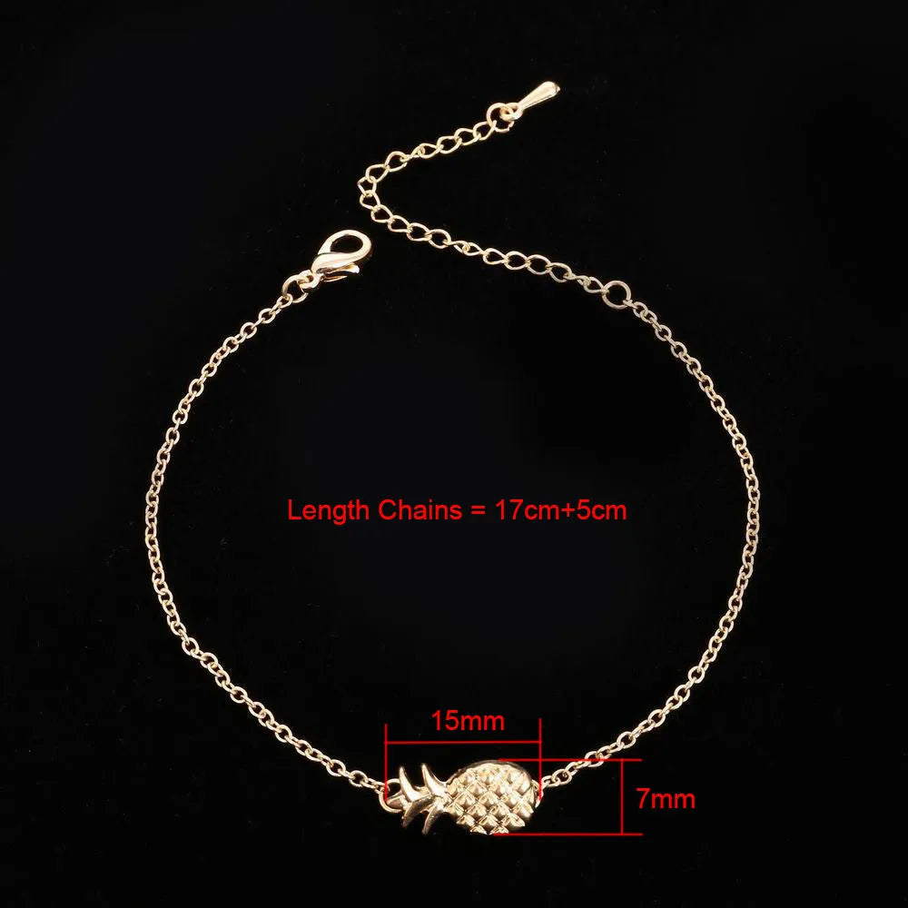 Gold or silver tone alloy bracelet with a central pineapple charm on a model's wrist.