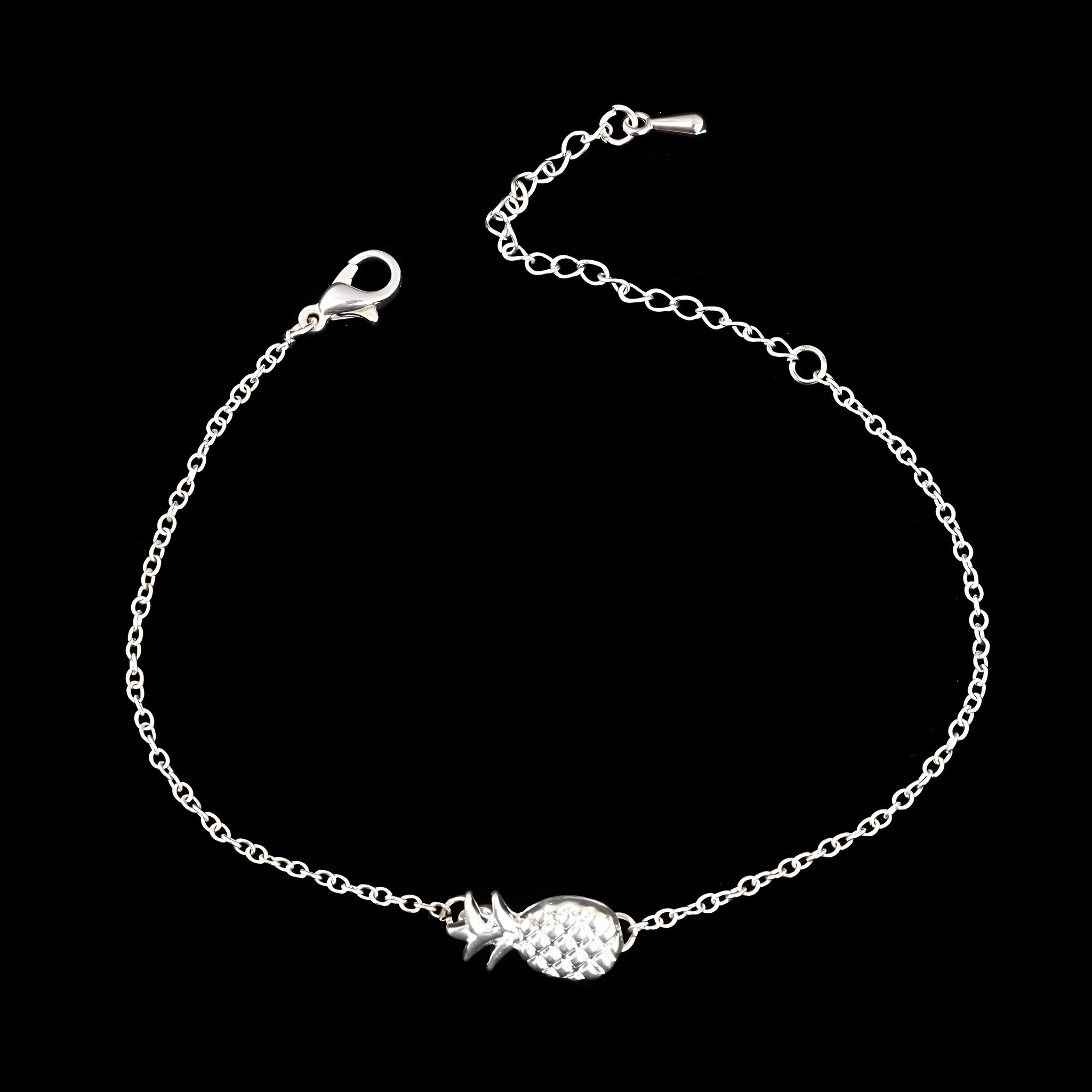 Gold or silver tone alloy bracelet with a central pineapple charm on a model's wrist.