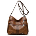 Brown woven PU messenger bag with single shoulder strap, showing multi-compartment interior with zippered change purse