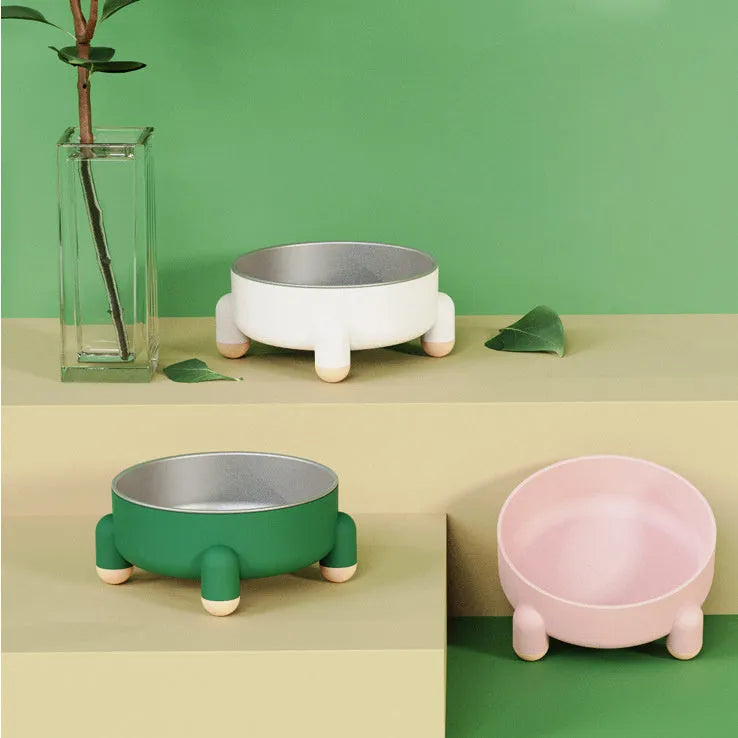 Stainless steel pet bowl with non-slip base and high foot in pink, green, or white colour.