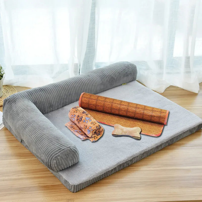 A corduroy dog sofa bed with raised sides in a grey colour, shown on a wooden floor.