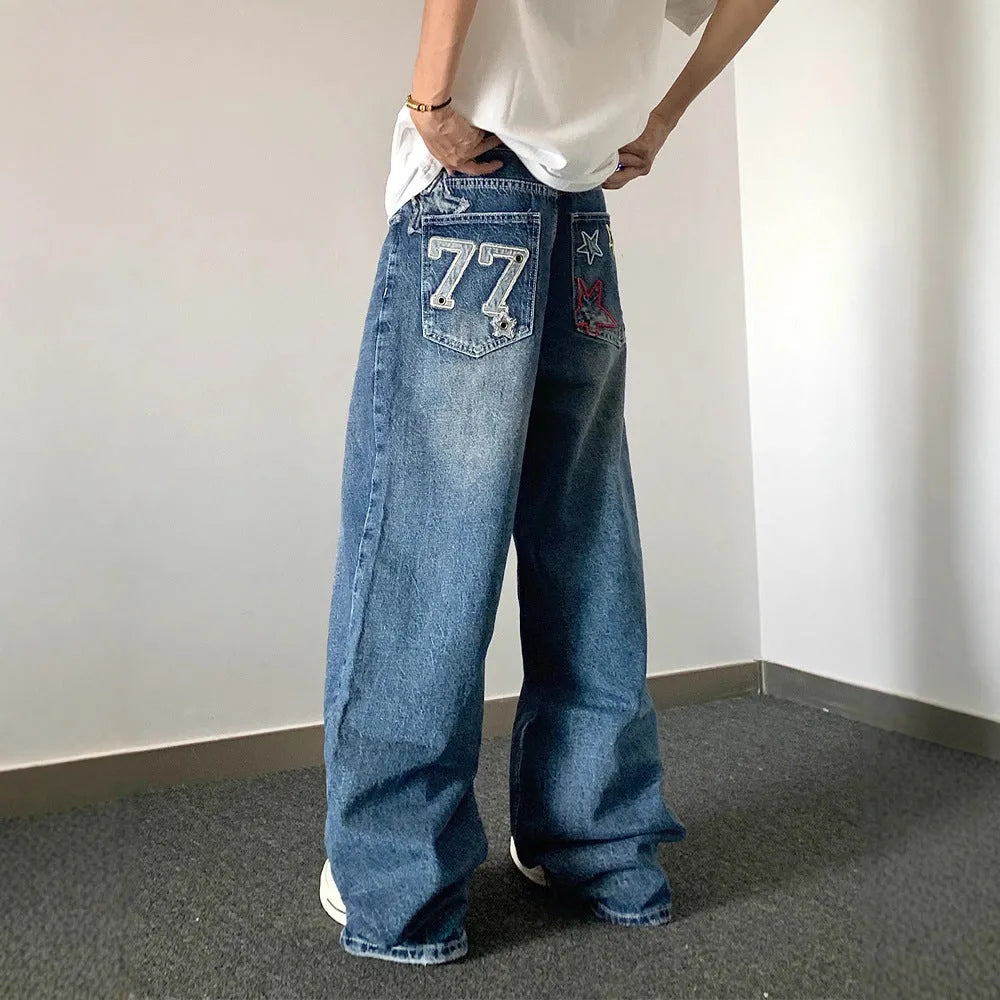 Blue designer embroidered high-waisted retro loose slimming trousers with mid waist and zip fly, sizes S to 3XL.