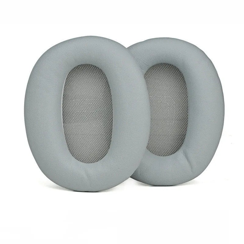 Black protein skin oval earphone sleeves for Walker W820BT headphones on a surface