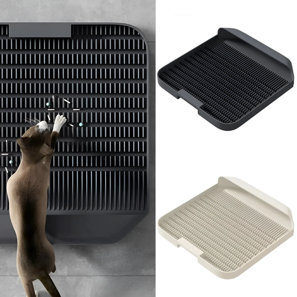Large black cat litter pedal with slanted mouth and textured non-slip mat next to litter tray
