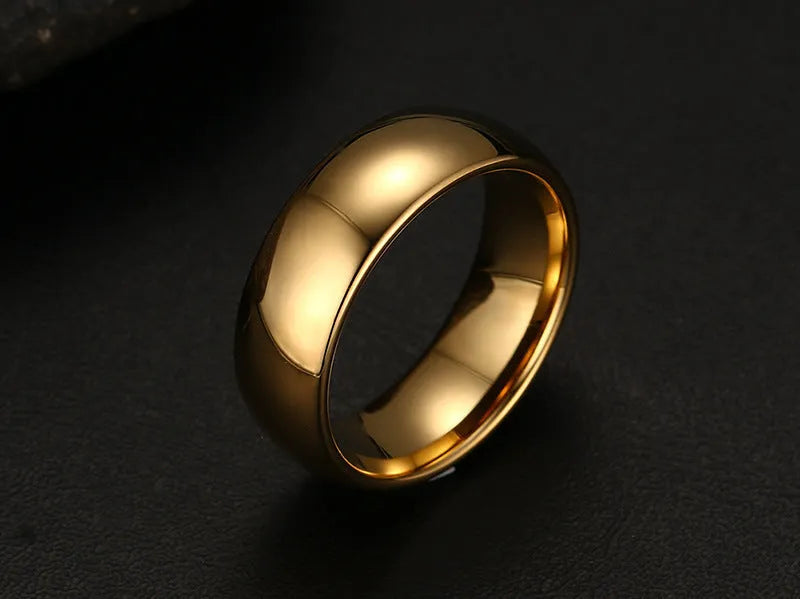 Gold tungsten carbide signet ring on display showing unisex design and metallic finish