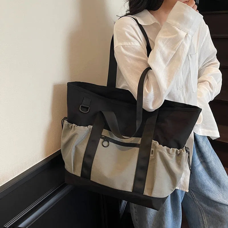 Grey women's lightweight Oxford cloth travel holdall for yoga and fitness.