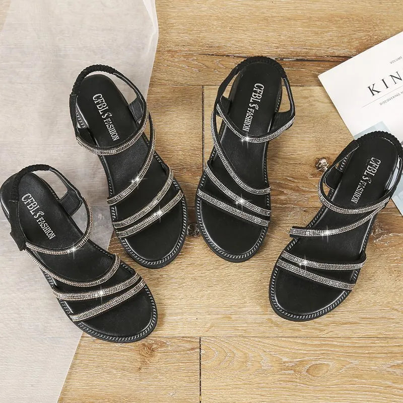 Women's silver Korean-style flat sandals with rhinestone details and an elastic strap.