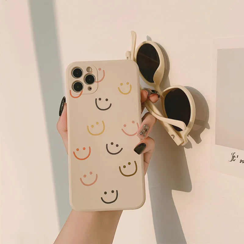 Silicone TPU phone case with painted smiley design for iPhone, shown in rainbow colour.