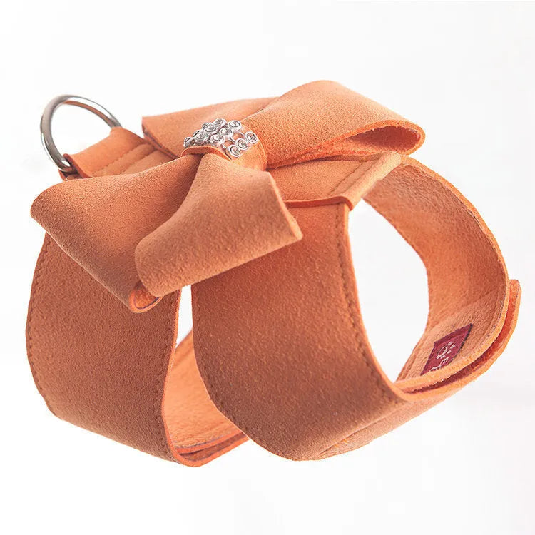 Cute pink puppy harness with a bowknot, made from soft microfiber, shown on a small dog.