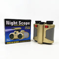 Children's telescope with light binoculars on a green field during sunset, showing the built-in light feature