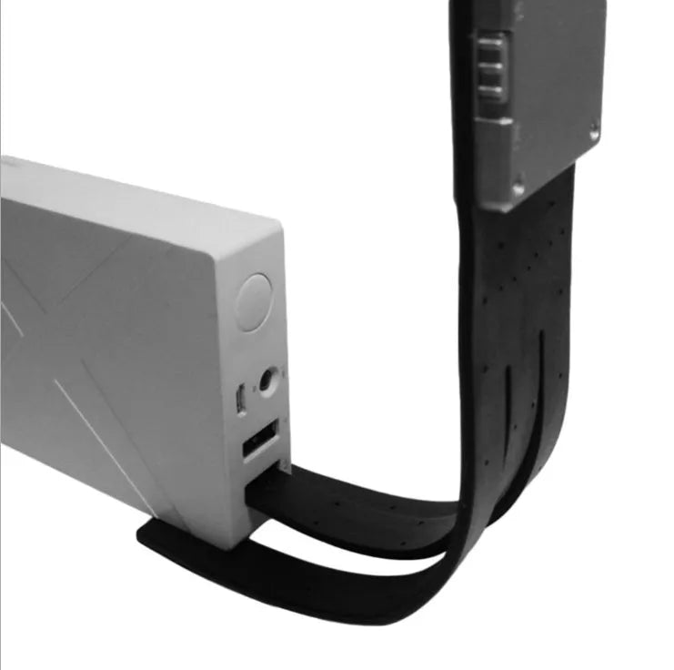 Black folding LED reading lamp with USB charging port and adjustable brightness settings