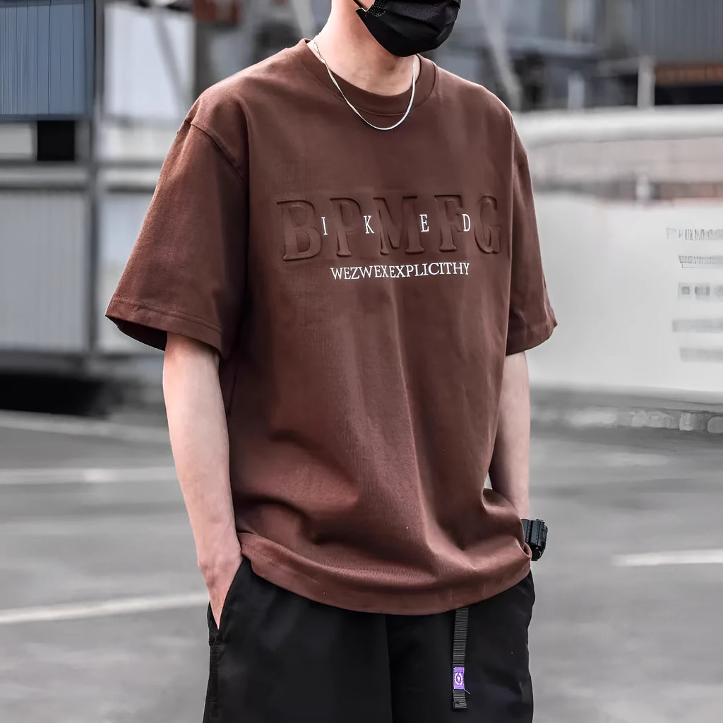 Men's short sleeve simple printed top in combed cotton available in brown, black, and white