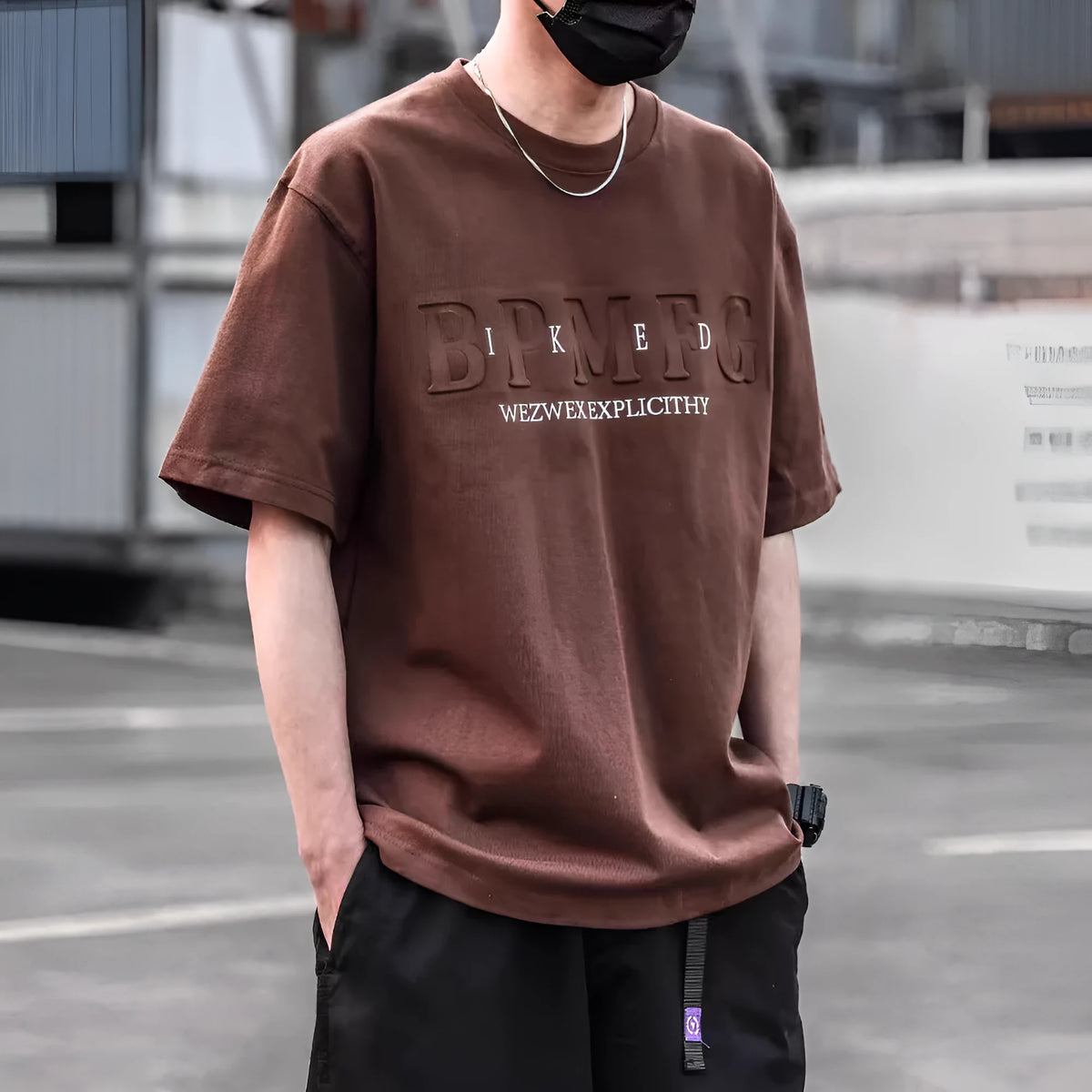 Men's short sleeve simple printed top in combed cotton available in brown, black, and white