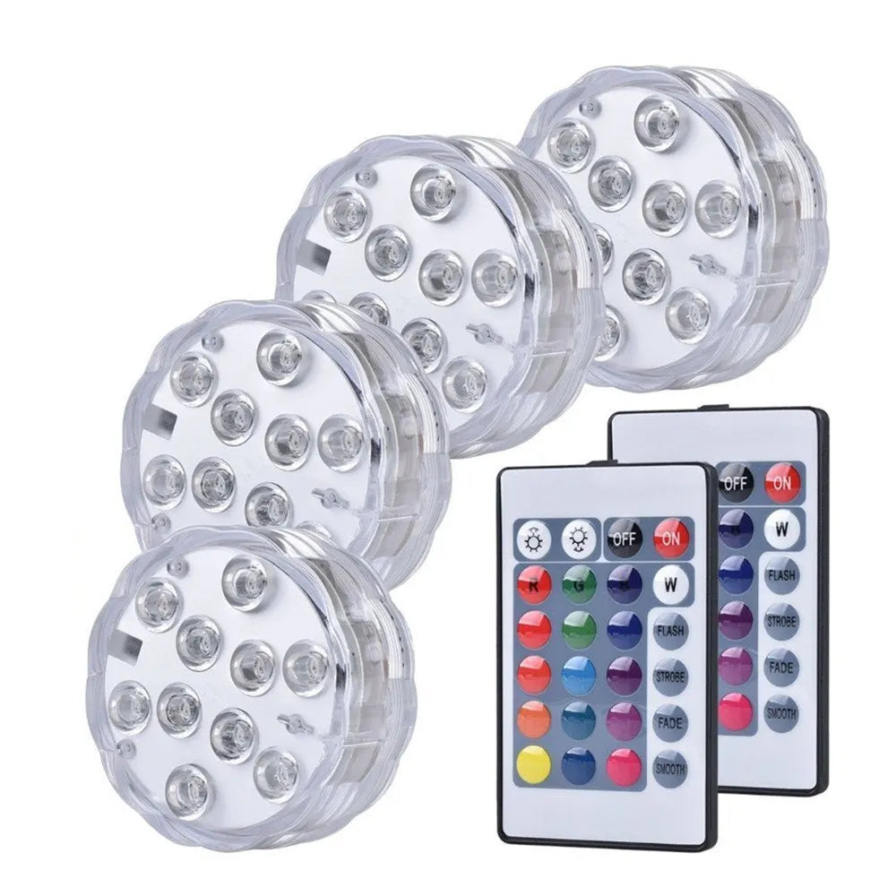 IP68 waterproof LED remote control diving light with 16 colour modes placed in a glass vase of water