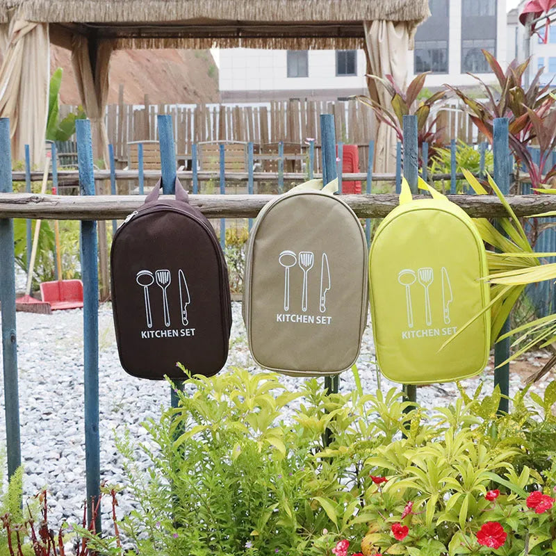 Portable picnic kitchenware storage bag containing 12 stainless steel pieces.