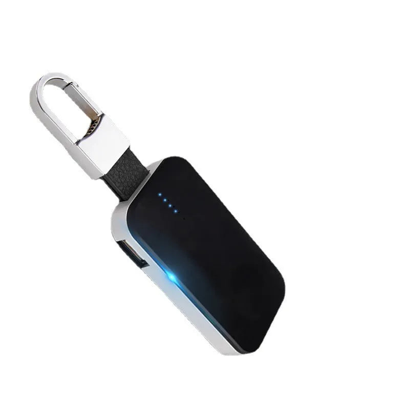Black portable keychain power bank for wireless charging of an Apple Watch.