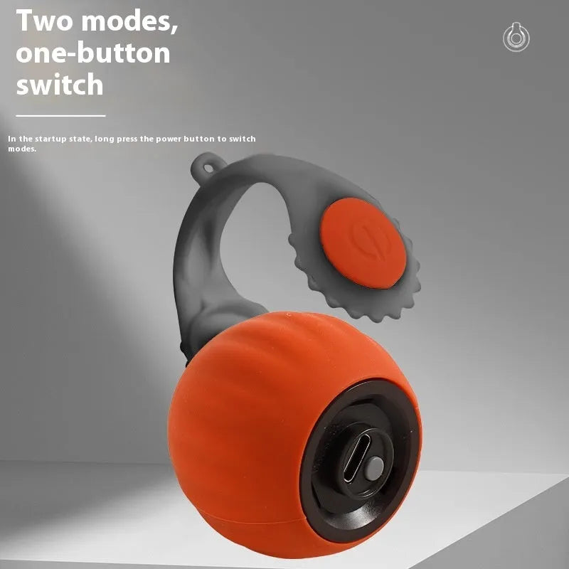 Orange and blue silicone gravity-powered cat toy with rolling ball and gun grip attachment options
