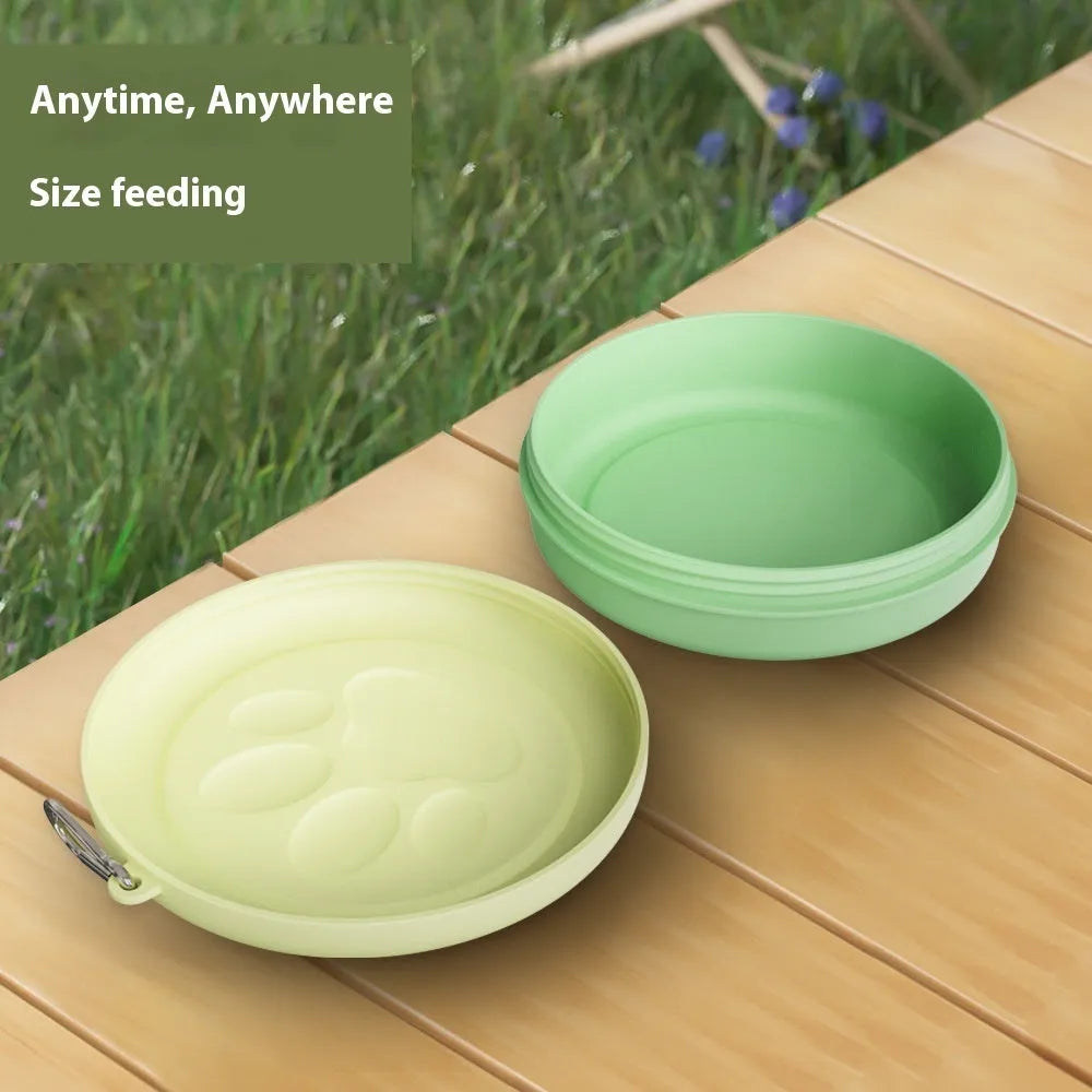 Portable dog feeding bowl shown in light pink and green colour options, suitable for food or water.