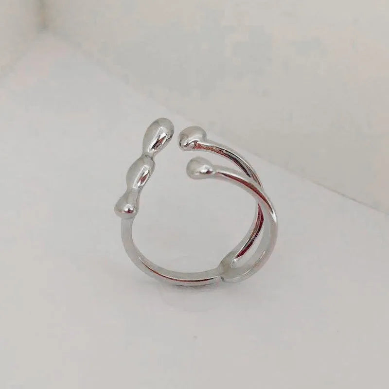 Brass opening ring with spherical design in gold or silver colour options