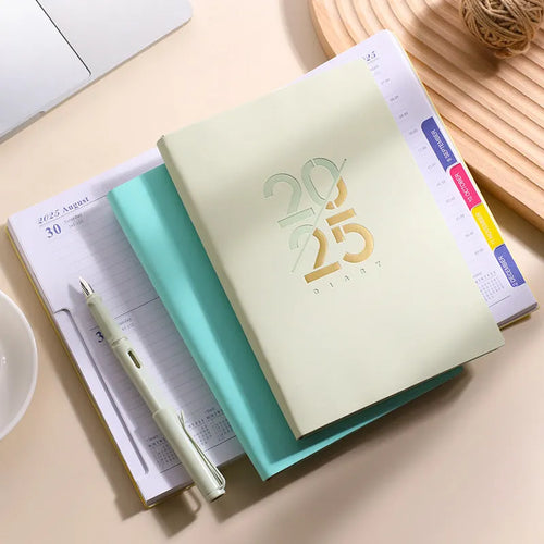 2025 A5 daily planner with soft faux leather cover in multiple colour options showing open pages