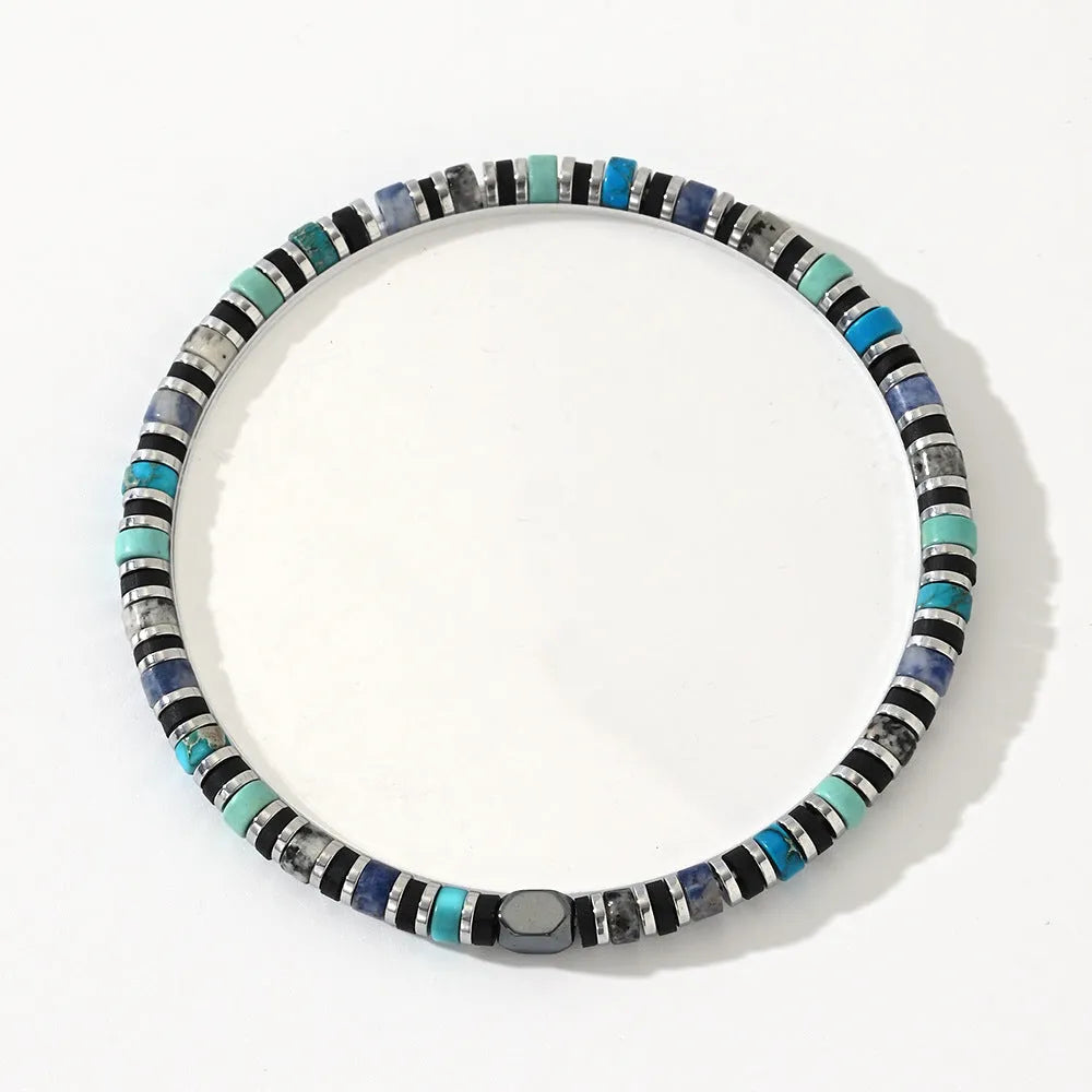 Hand-woven cylindrical bracelet with geometric pattern of natural semi-precious stones.
