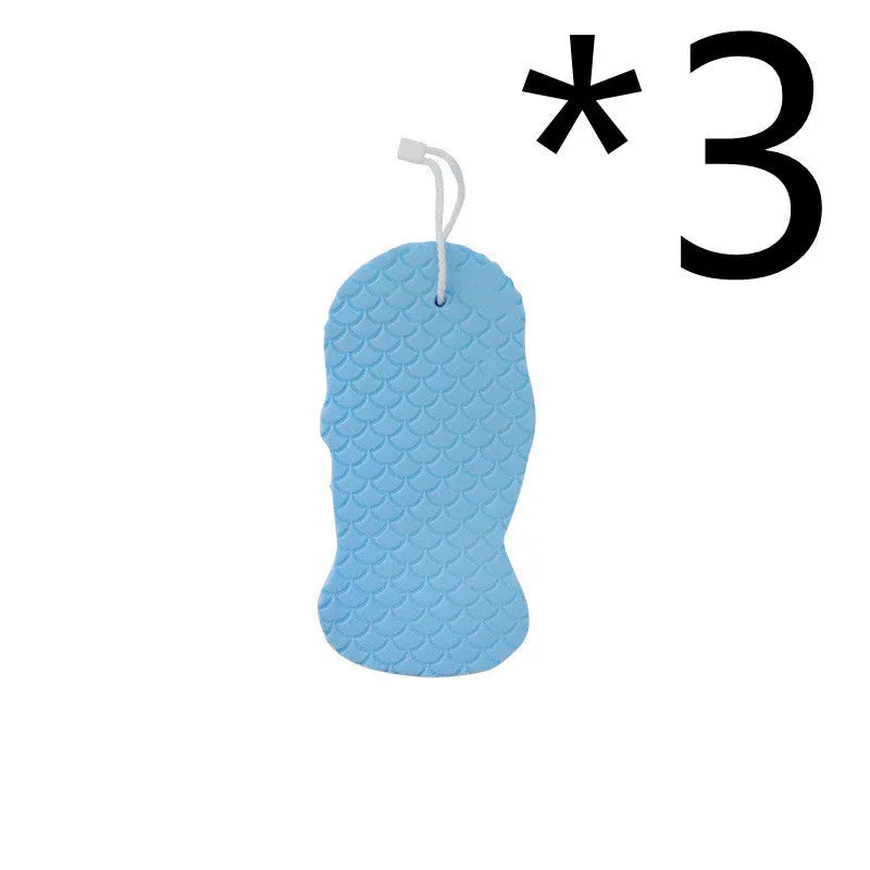 White 3D bath sponge with fish scale pattern for gentle body exfoliation in shower.