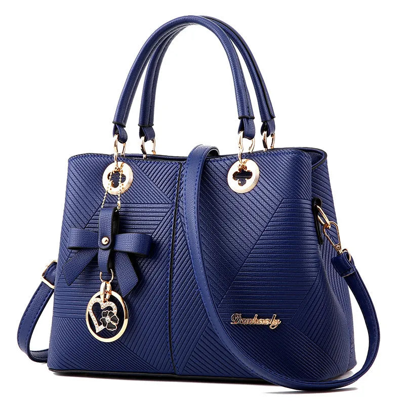 Retro fashion handbag in PU leather with a single shoulder strap and zipper closure.