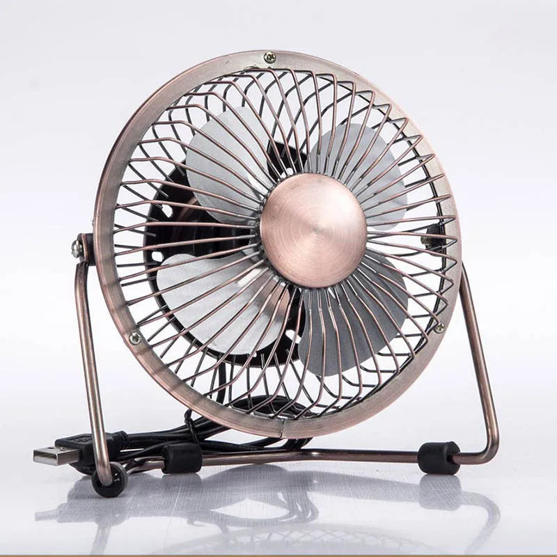 4-inch bronze aluminium USB mini fan with rocker switch on a desk