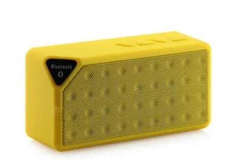 Small cube-shaped Cannon X3 wireless Bluetooth speaker in one of five colours: black, blue, green, red, or yellow.