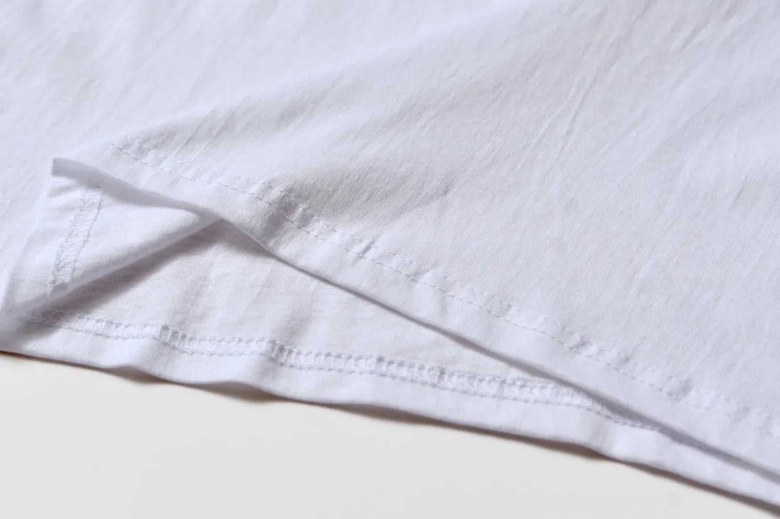White cotton denim overalls with round neck and short sleeves, loose fit pullover style