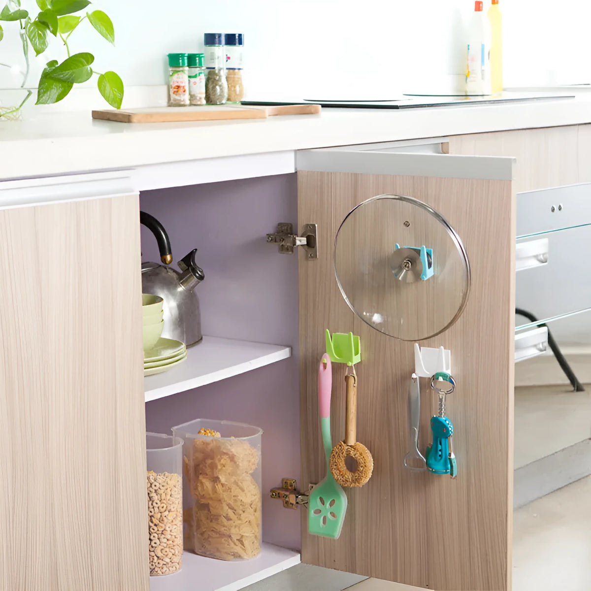 Wall-mounted PP plastic kitchen lid holder in blue, green or white, stuck inside a cabinet for lids and utensils.