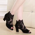 Black lace gladiator sandals for women with a square high heel, peep toe, and a zip closure.