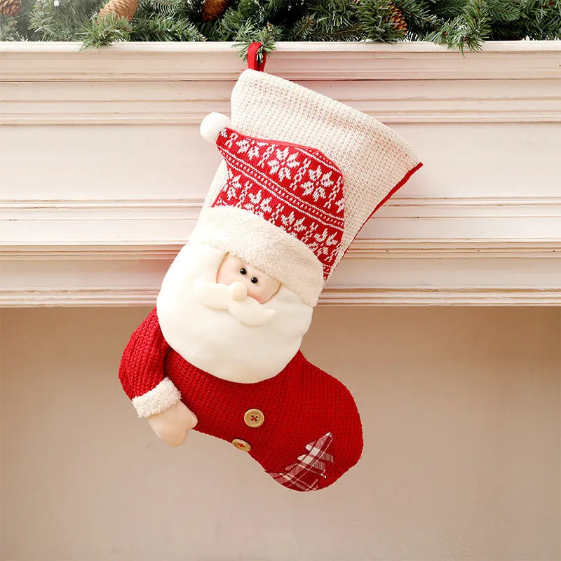 Large red and white knitted Christmas stocking with Santa Claus design hanging from fireplace