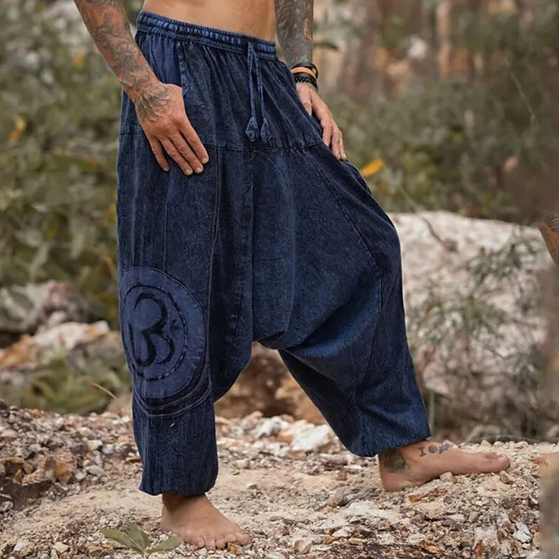 Dark green men's trousers with ethnic pattern and ankle tie detail, mid waist fit