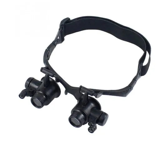 Black double eye magnifier glasses with LED lights and multiple lenses for hands-free watch and electronic repair.