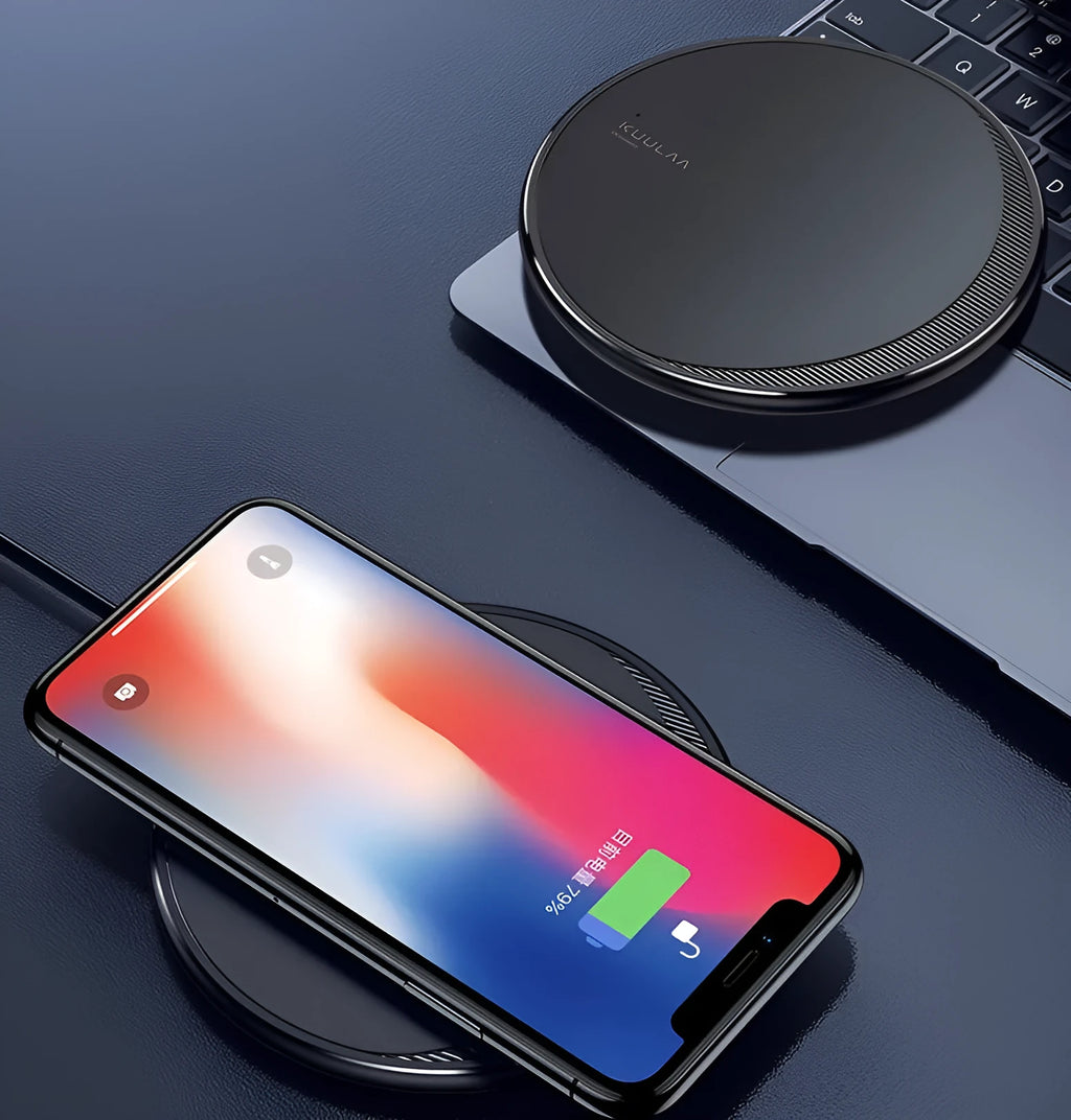 Black Kuulaa KL-CD16 wireless disc phone charger on a surface with LED light on.