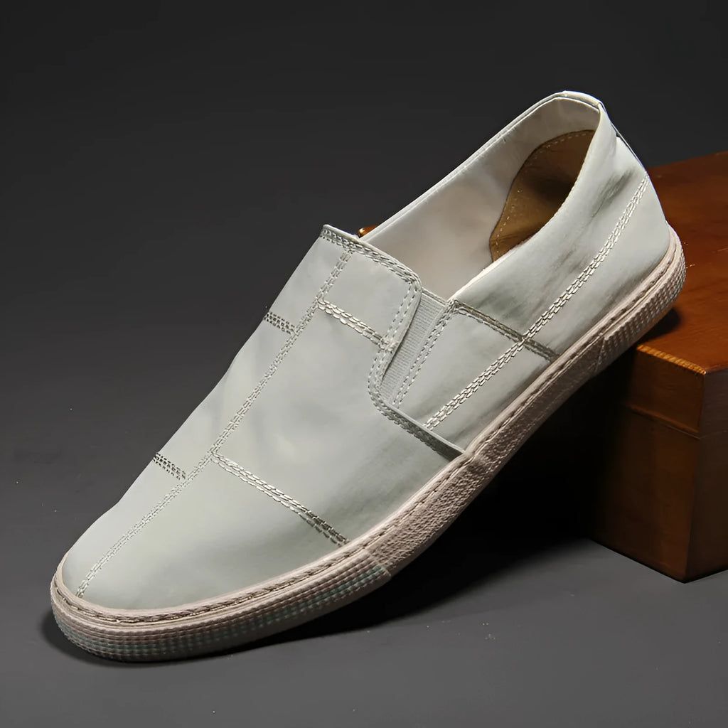 Men's low-top canvas slip-on shoes in khaki colour with a round toe and vulcanised rubber sole.