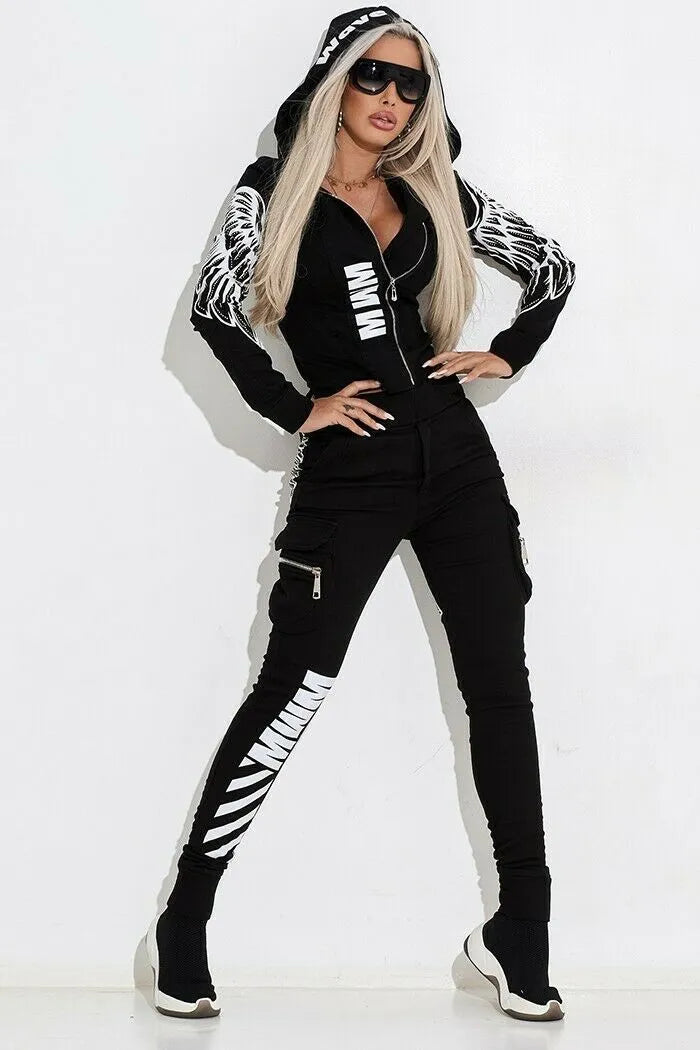 Black women's printing zip hooded casual suit with matching trousers on a hanger.