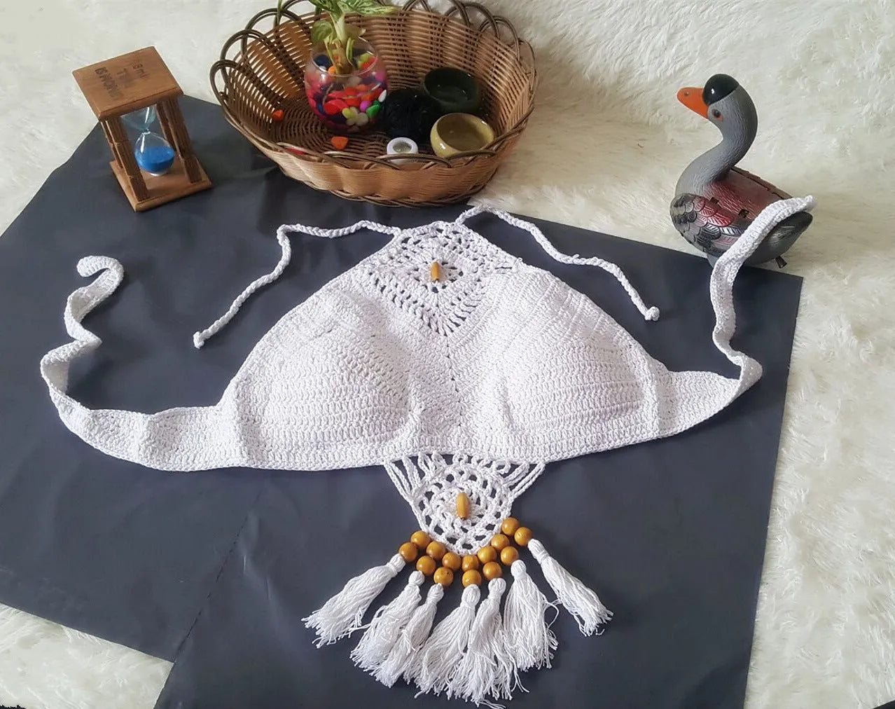 Crochet tassel bikini set for women in black, showing textured weave and tassel trim, beach style