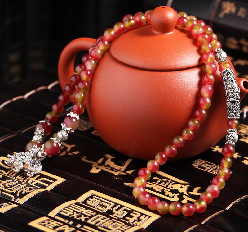 Handmade natural watermelon crystal bracelet with Chinese knot closure in national style.