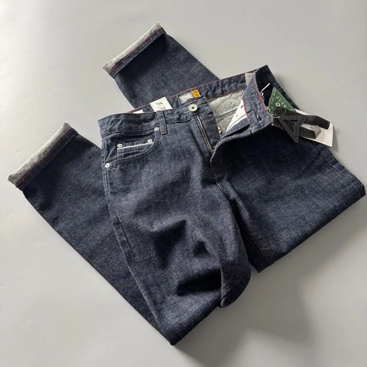 Men's straight leg denim jeans in primary colour showing mid waist fit and classic American retro style.