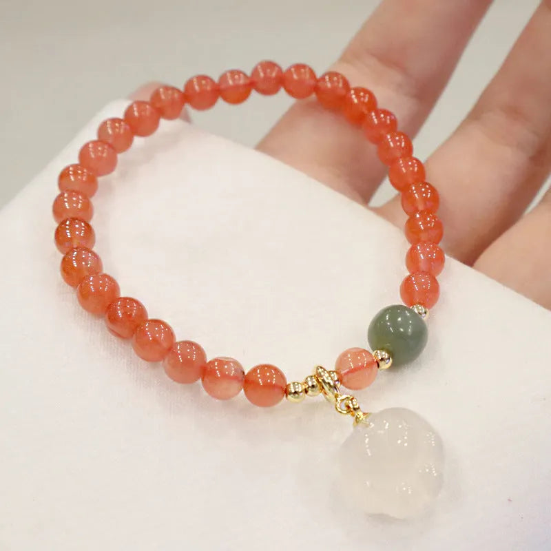 8mm natural red agate bracelet with jade inlay and cat paw animal charm