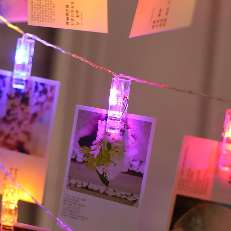 LED heart-shaped clip light string decorating a wedding cake with warm white lights.
