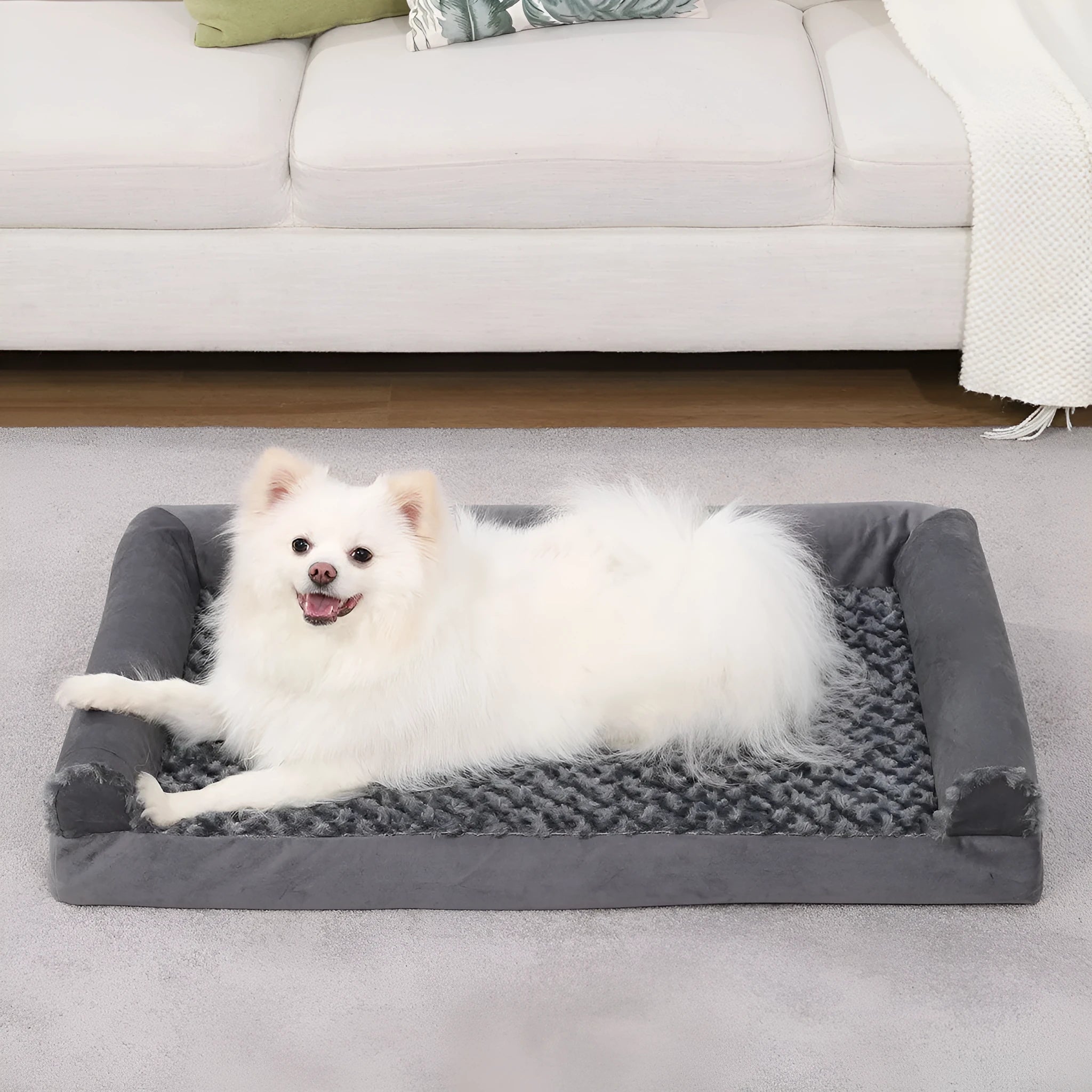Grey U-shaped removable cover dog sofa for pets on a wooden floor