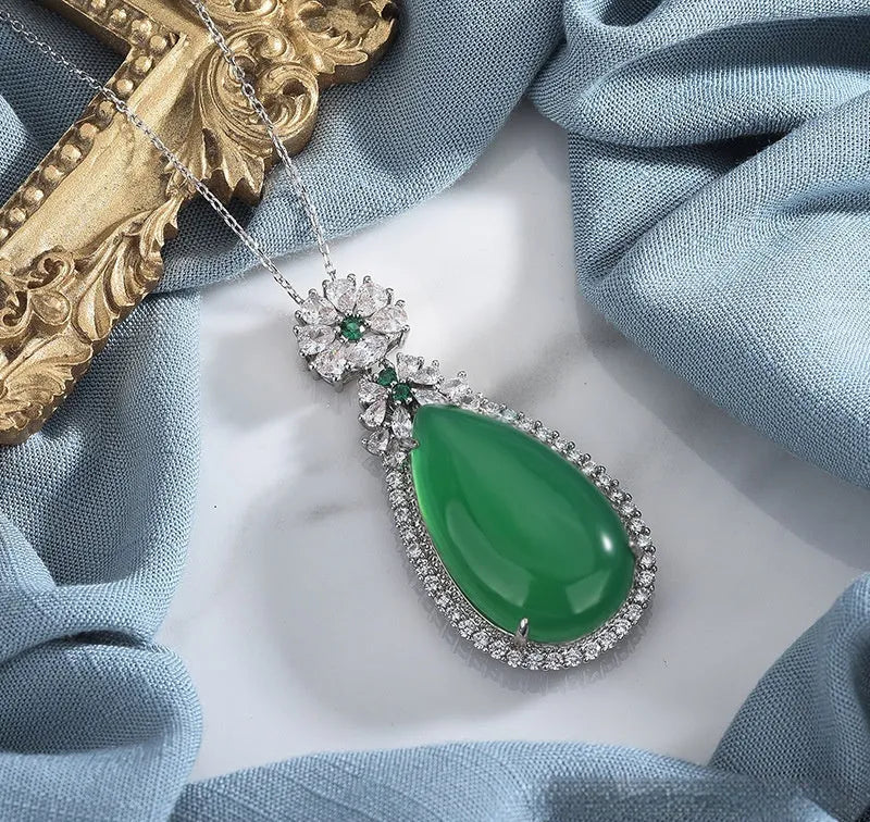 Green chalcedony water drop pendant with geometric ellipse shape and electroplated copper setting