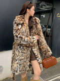 Artificial fox fur coat with fur collar in street fashion style with pockets
