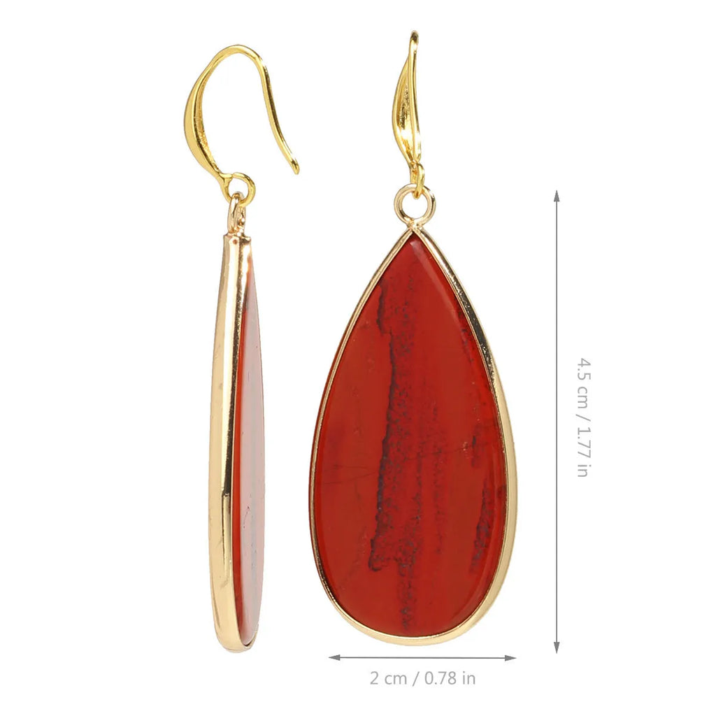 Vintage long water drop earrings in tigereye stone with textured surface and dangle silhouette