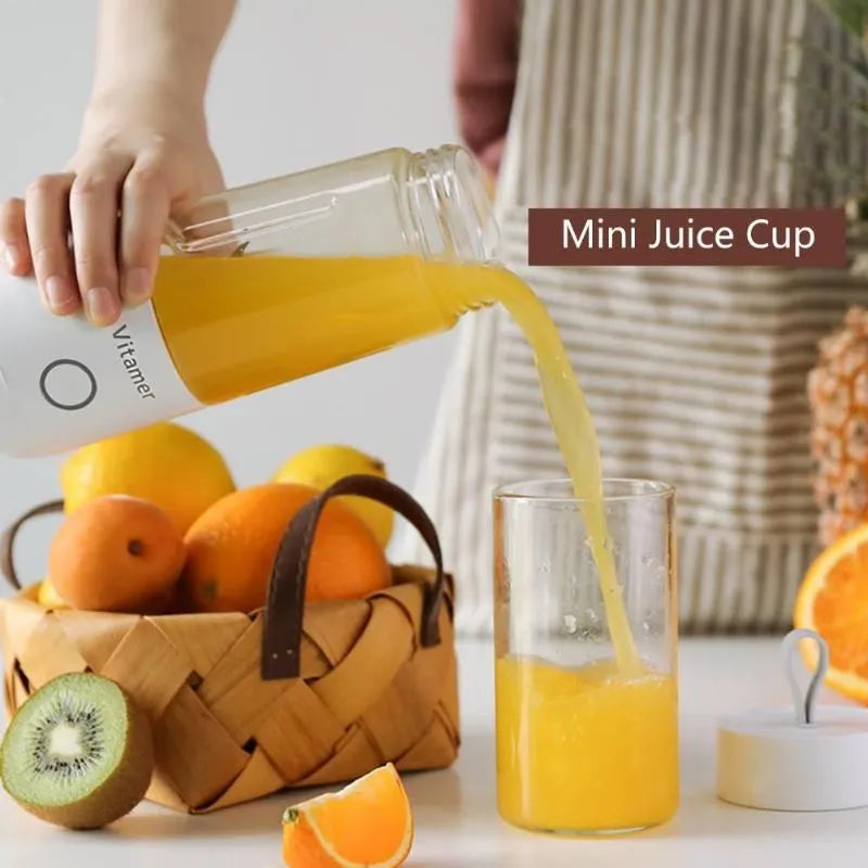 White portable USB blender bottle with silicone ring, 350ml capacity, and stainless steel blade on base.